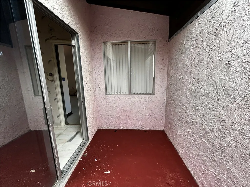 Full bath with sunken bathtub & extra room with skylight