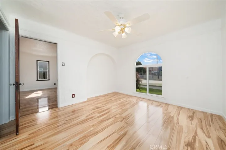 Bedroom # 1 with arched window and matching cove