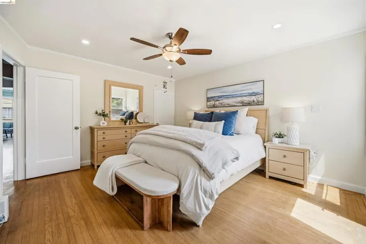 Hardwood flooring throughout, featuring a ceiling fan with integrated lighting, recessed lighting, and a white interior door with a brushed nickel​​‌​​​​‌​​‌‌​​‌​​​‌‌​​​‌​​‌‌​​‌‌​​‌‌​​​​ knob