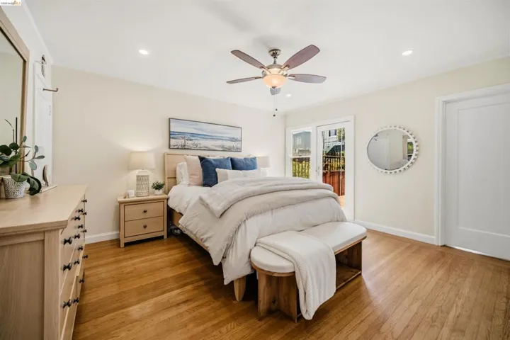 Hardwood flooring throughout, recessed lighting, and a ceiling fan with light fixture