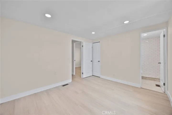 Back Bedroom with view of closet and bathroom