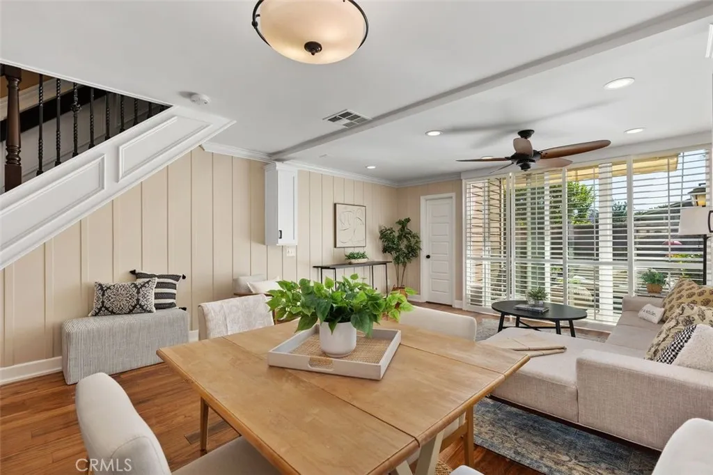 Dining Area – Bright dining space with ceiling fan, hardwood flooring.
