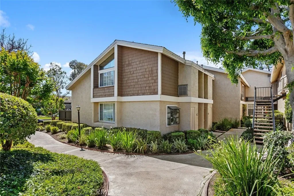 Exterior Front – Welcoming front elevation framed by mature landscaping and a private entry walkway.
