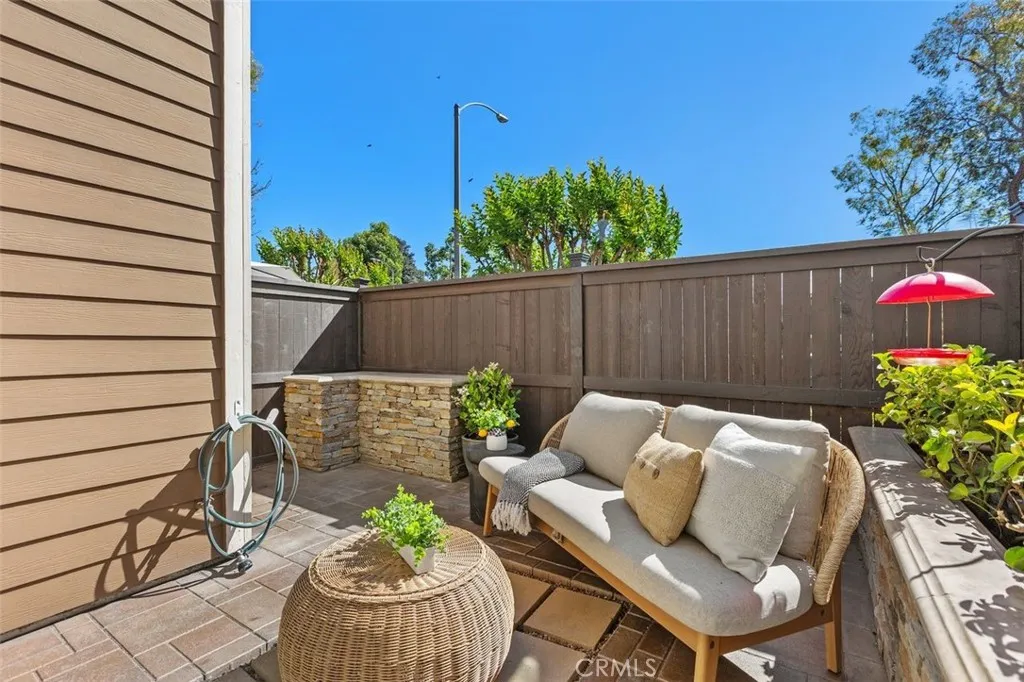 Patio – Private patio area with BBQ area with natural gas hookup, prep surface, mature greenery, and space for outdoor seating.
