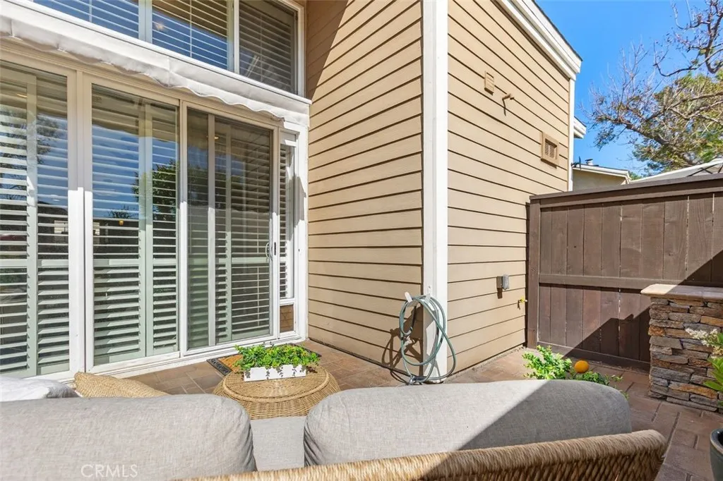 Patio Access – Sliding glass door opens to a private patio, creating easy indoor-outdoor flow. Overhead is a new retractable awning.
