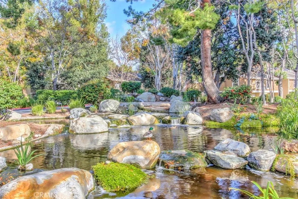 Community Grounds – Natural-style common area with rocks, trees, lakes.
