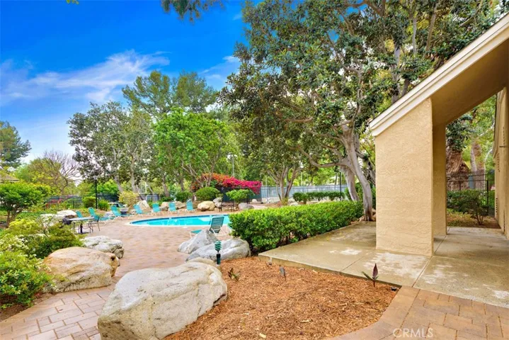 Pool Area – One of two pools and two spas available for community use surrounded by trees and nature.

