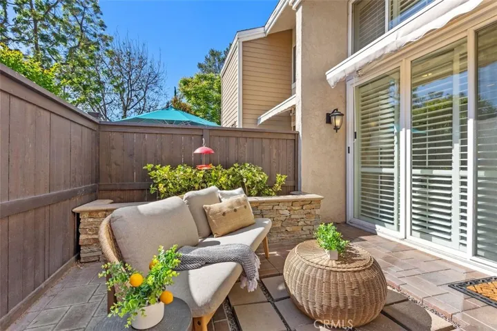 Patio – Outdoor patio framed by landscaping and exterior walls for a comfortable private retreat.
