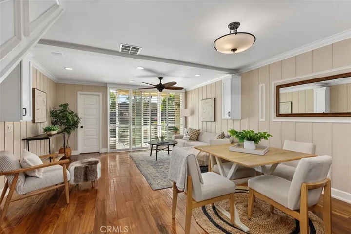 Dining Area – Light-filled dining space with hardwood flooring, neutral finishes, and easy flow to the kitchen and living areas.
