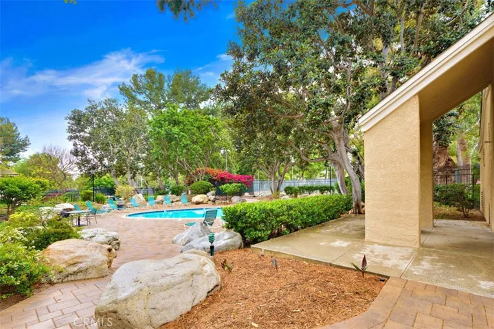 Pool Area – One of two pools and two spas available for community use surrounded by trees and nature.

