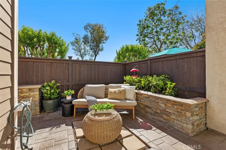 Patio – Enclosed outdoor patio offering room for dining, lounging, or container gardening.  
