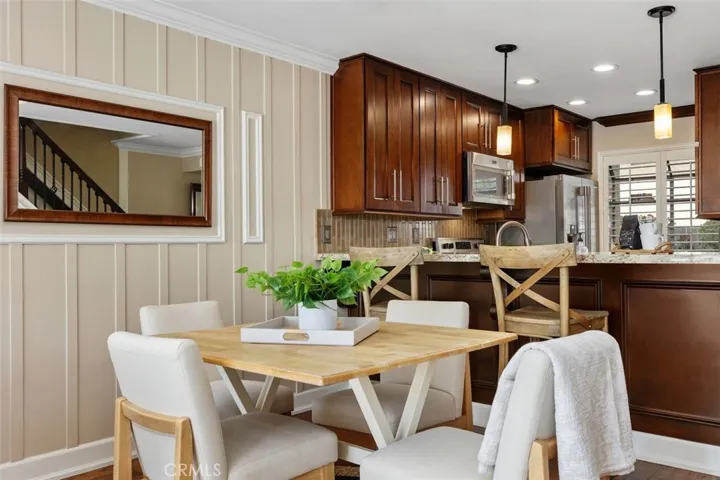 Kitchen/Dining – Dining area positioned beside the kitchen, offering convenient access for meals and entertaining.
