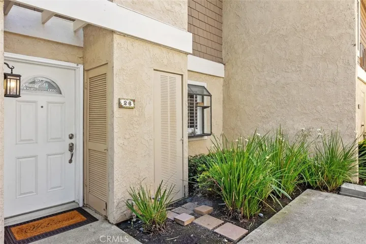Front Entry –  with clean exterior finishes and HOA maintained landscaping.