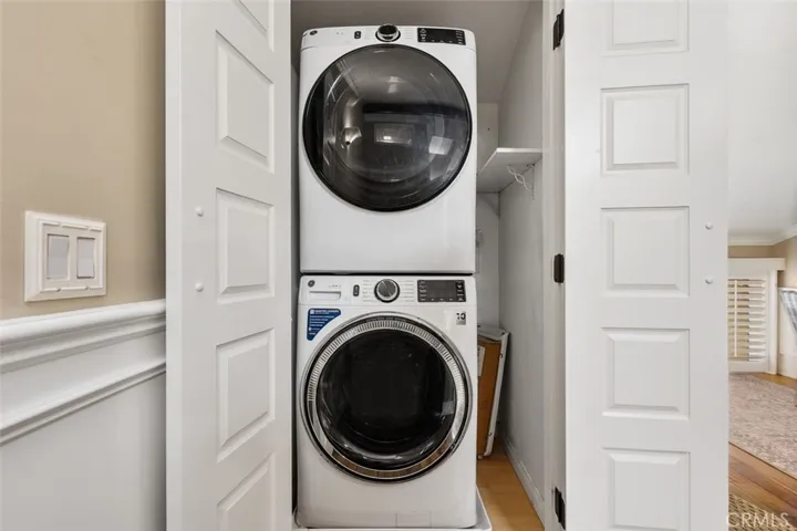 Laundry – Upstairs Interior laundry closet with stacked washer and dryer for convenient in-home laundry access.