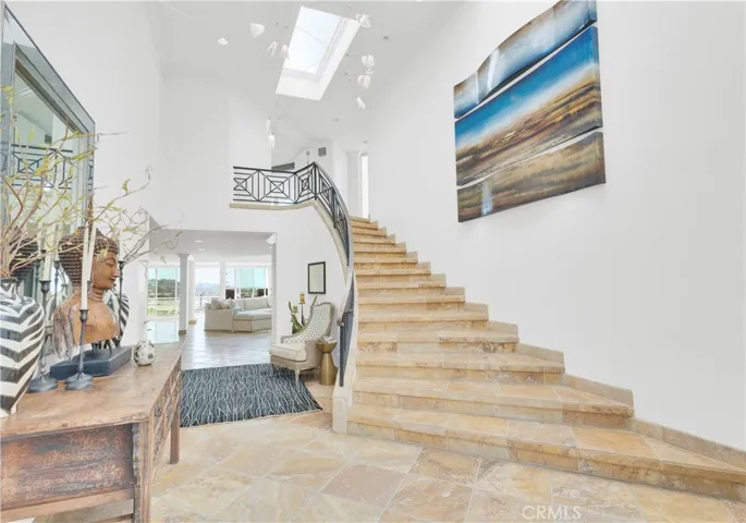 Travertine underfoot, bringing warmth and continuity throughout.