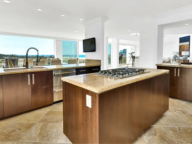 Open kitchen with generous island and integrated gathering space.