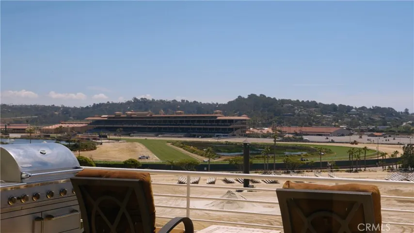 Racing season from this vantage. Seamless indoor–outdoor flow oriented to the view.