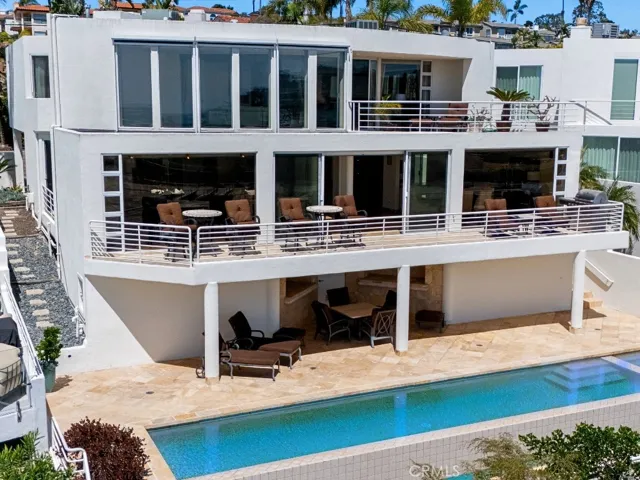 Elevated hillside position captures the racetrack, lagoon, and ocean beyond.