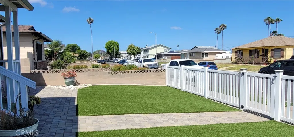 Front yard with vinyl fencing