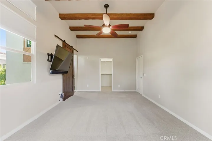 large master with high ceilings, beams and views!