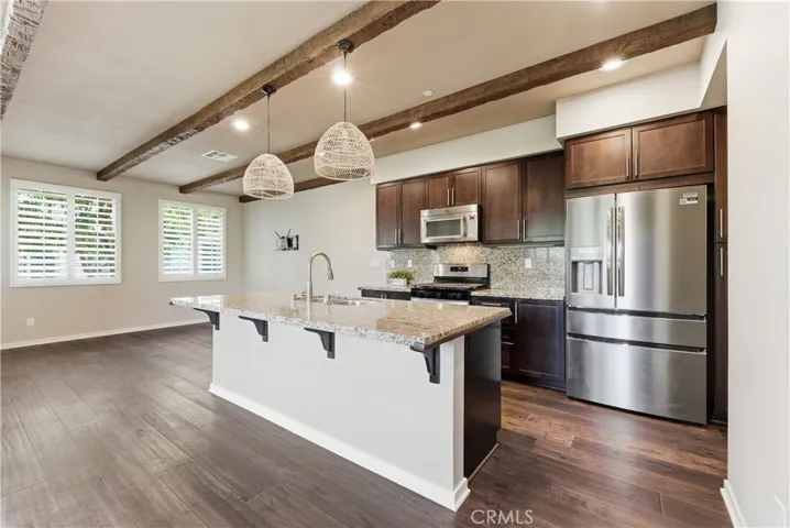 Beautiful open kitchen with granite,New refrigerator, new oven/range and shutters!