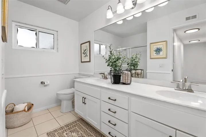 The upstairs secondary bathroom gleams with pride of ownership!