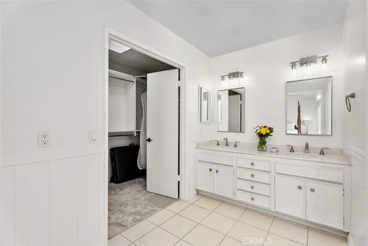 Smart and spacious! The primary suite features a dedicated dressing area and vanity, with a separate shower space for added privacy.