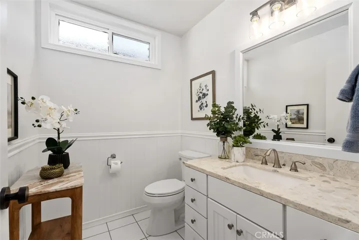 Pride of ownership shines through this bright main floor bathroom, including brand new fixtures!