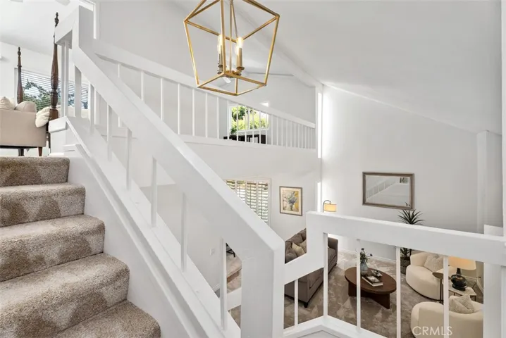 Bright and airy! Freshly painted interiors and a stylish new light fixture lead the way to the peaceful upper level.