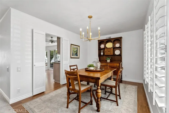 Cottage-style warmth. This cozy dining room is perfectly positioned for everything from morning tea to holiday dinners. Plantation shutters and soft natural light make every meal feel like a special occasion!