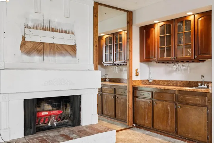 Fireplace with brick hearth and white mantelpiece