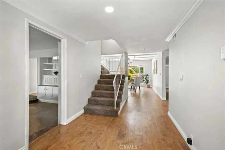 Stairs off family room and front door
