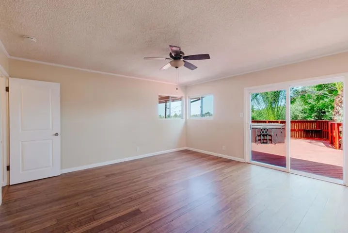 Master bedroom with sliders to deck and spa