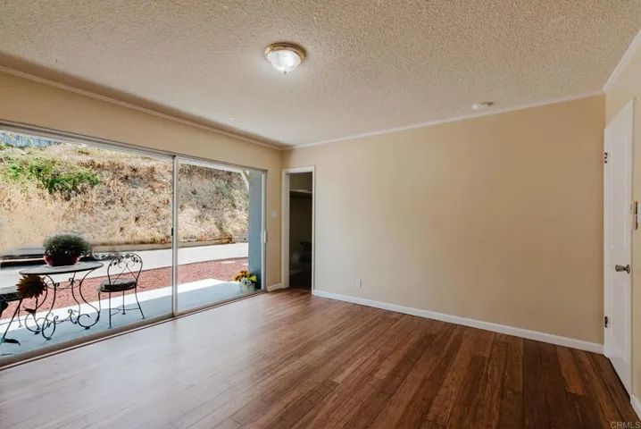 Second bedroom with sliders to patio