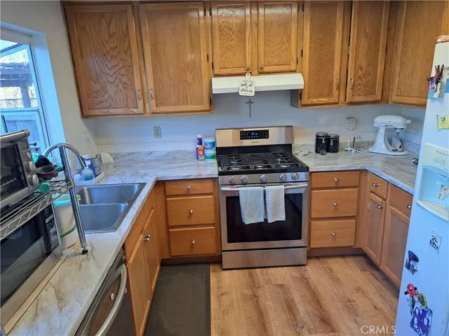 CURRENT VIEW - NEWER STOVE-DISHWASHER - NEW COUNTERTOPS.