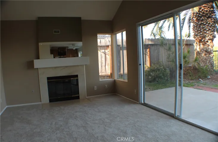 FIREPLACE & FAMILY ROOM WHEN EMPTY - DIFFERENT FLOORING TODAY - VINYL PLANKING