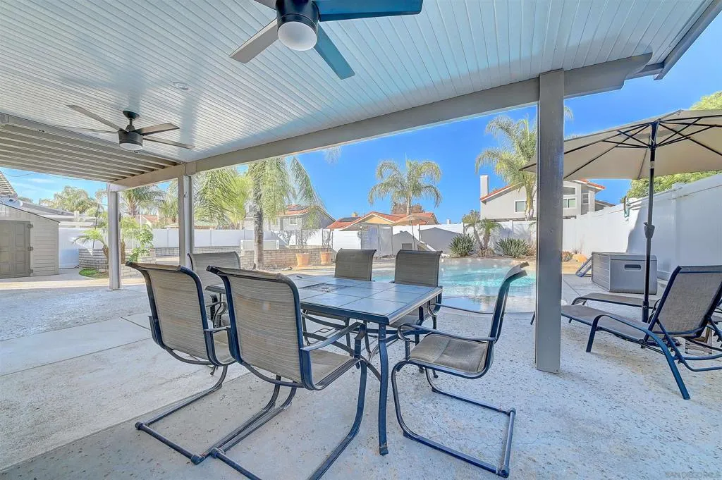 Dine al fresco every night of the year. Covered alumawood patio with ceiling fans, a full outdoor dining set for six, pool and palm views, and chaise lounges at the ready — this is the Southern California outdoor lifestyle at its finest.????????????????