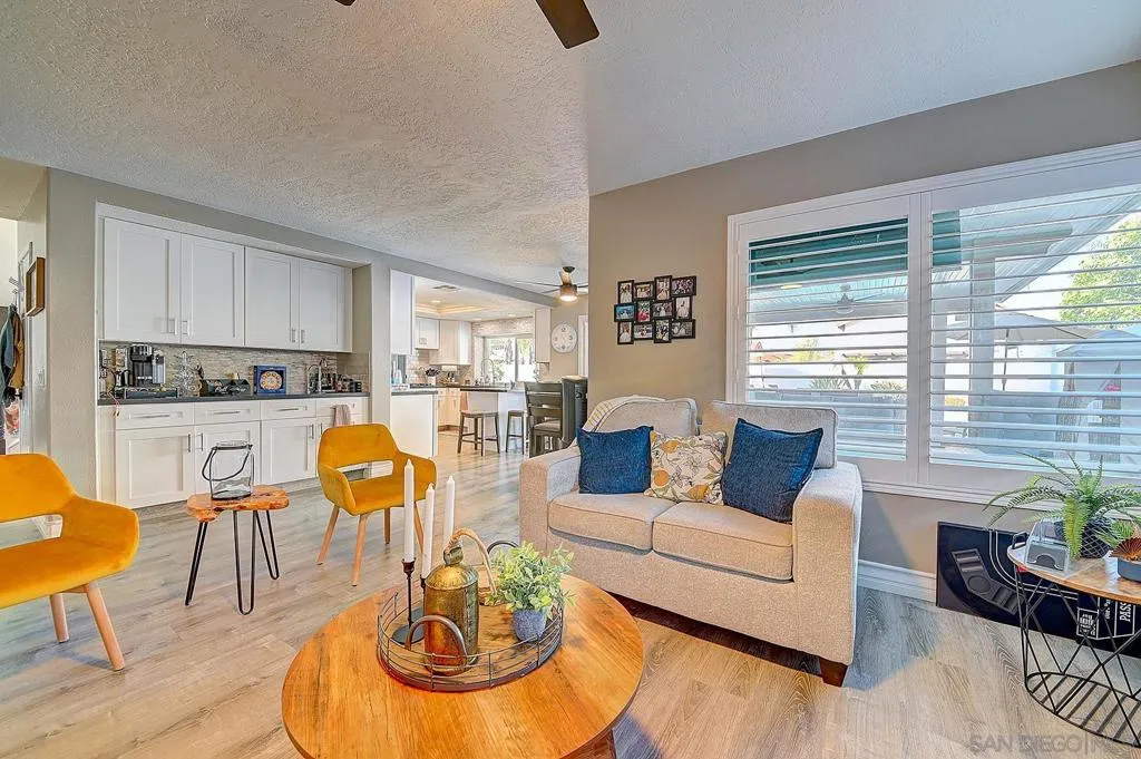 The entertainer’s triangle. Wet bar, family room, and kitchen all connected in one seamless open flow — grab a drink, gather around the fire, or step straight out to the pool. This is the layout buyers dream about.