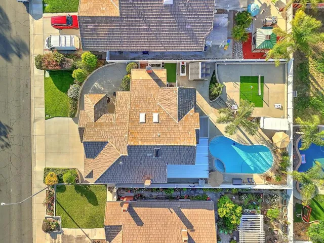 Rare overhead view reveals the full scope of this oversized lot. Pool, spa, covered patio, turf area, and generous hardscape — all within a fully enclosed private yard. Lot size like this is hard to find in South Temecula at any price.