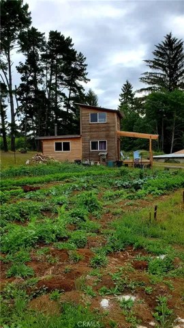 Tiny home with garden and green house