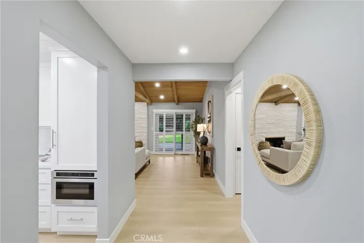 Entryway opens to the living room/kitchen/hallway.
