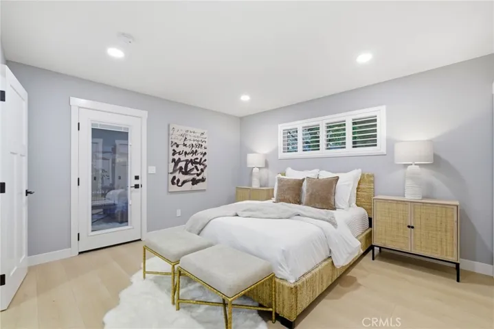 Primary bedroom has has exterior door that opens to the back patio.