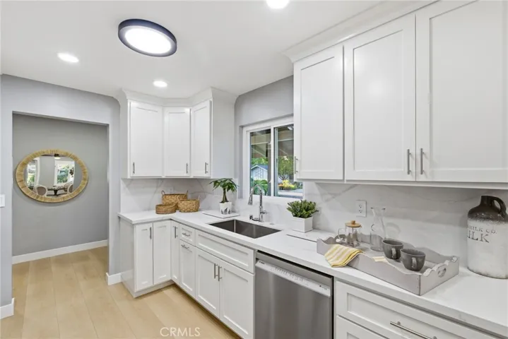 Marble countertops extend seamlessly onto the windowsill.