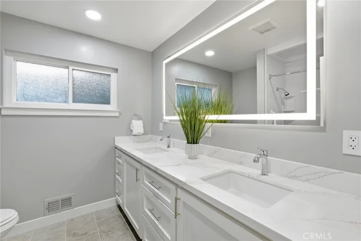 Designer bathroom finishes with custom built cabinetry.,