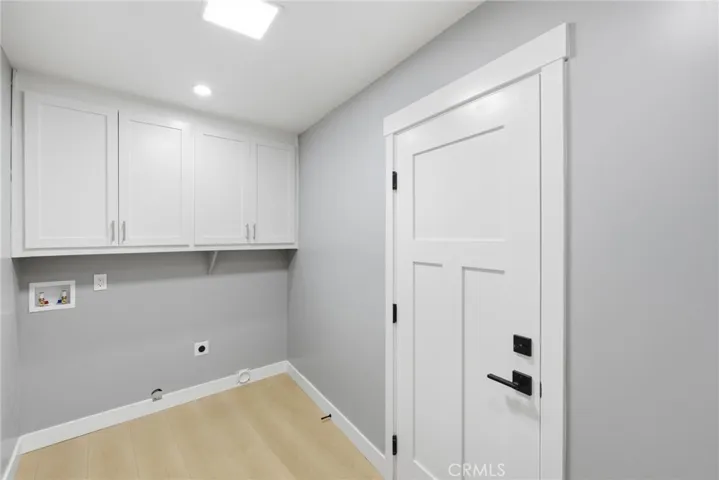 The laundry room has an exterior door to the back patio.