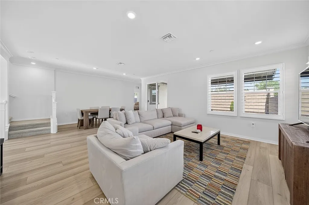 cozy living room complete with beautiful wood shutters