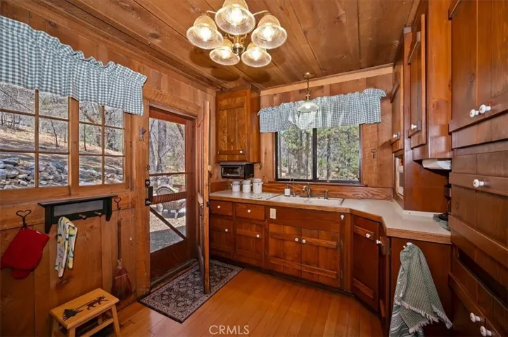 Full kitchen and door to backyard  mountain