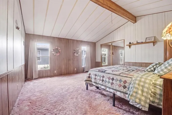 Primary Bedroom with mirrored closet doors