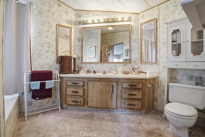 Primary Bathroom with separate tub and shower, double sink vanity