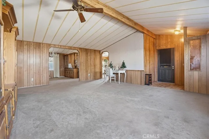Family room, ceiling fan and vaulted ceiling